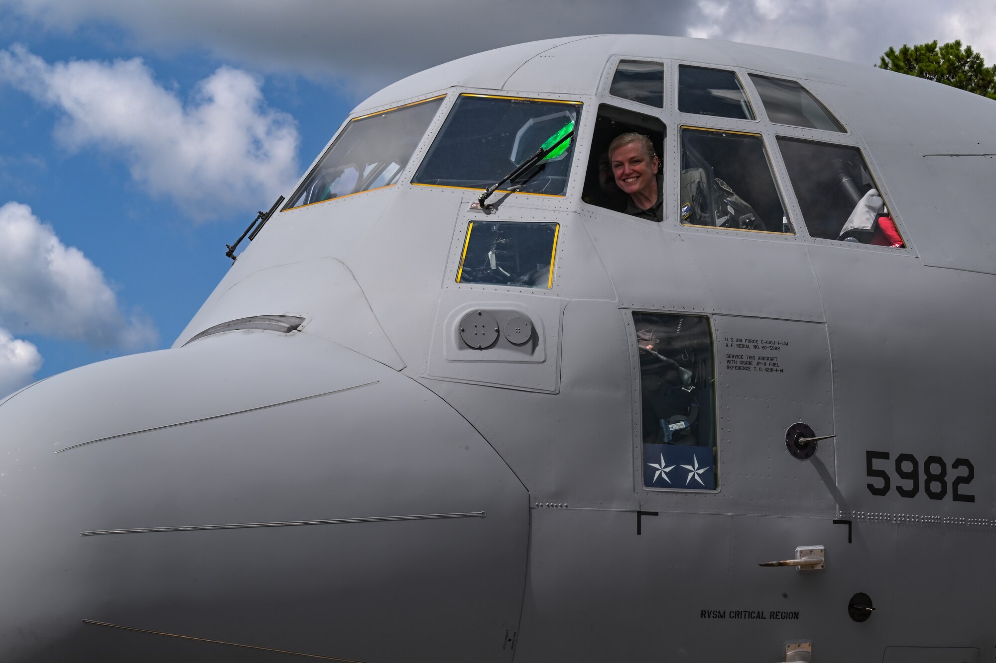 Maj. Gen. Melissa Coburn, 22nd Air Force commander, poses for a photo in the flight deck of the C-130J-30 Super Hercules prior to takeoff at the Lockheed Martin production facility, Marietta, Georgia, July 16, 2024.
