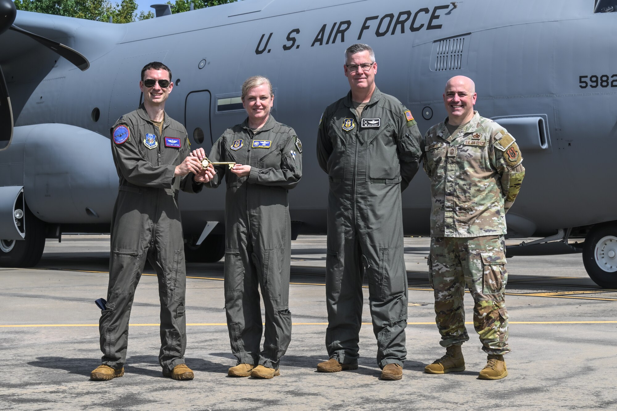 Maj. Gen. Melissa Coburn, 22nd Air Force commander, receives the ceremonial key for the new C-130J-30 Super Hercules at the Lockheed Martin production facility, Marietta, Georgia, July 16, 2024.