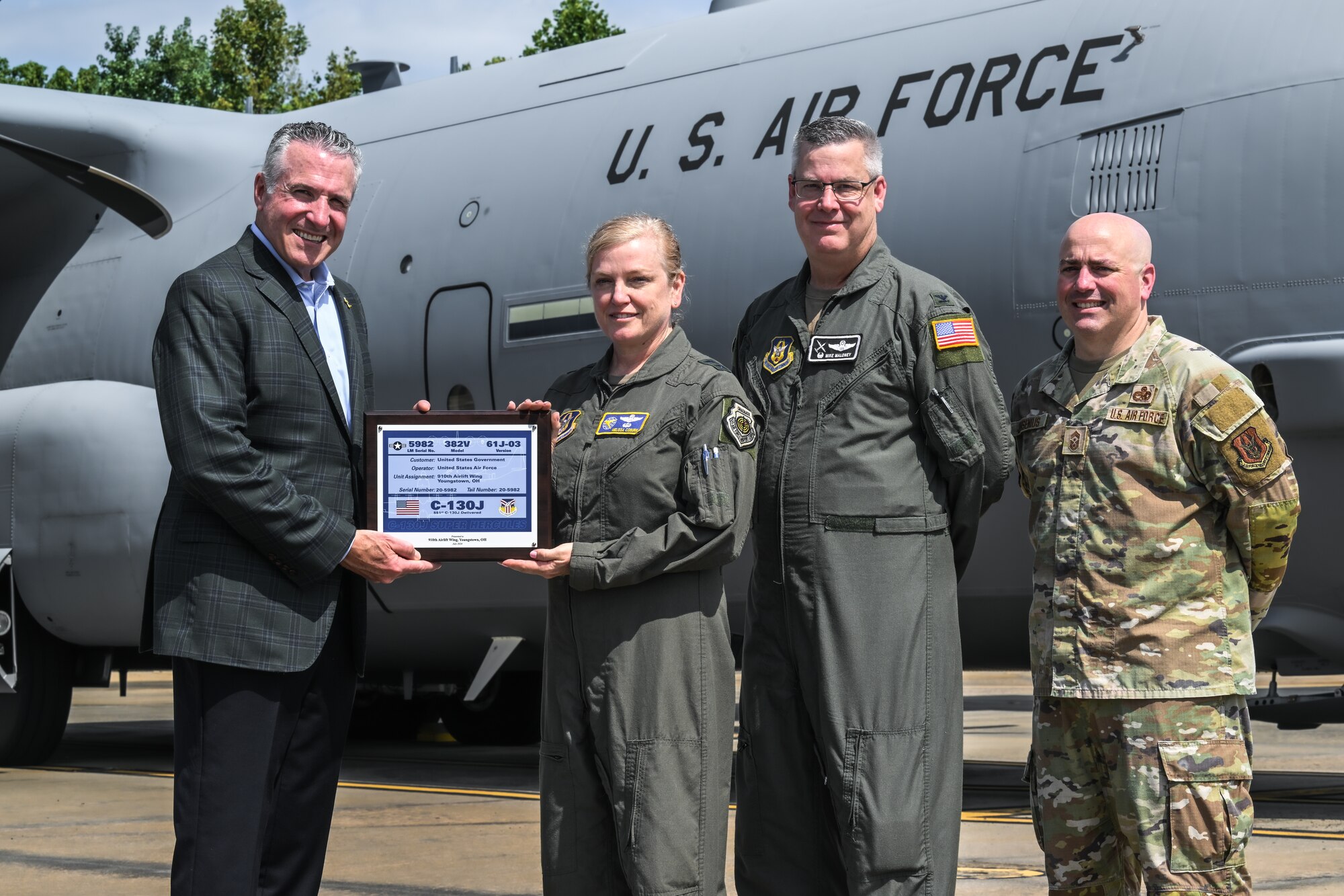 Maj. Gen. Melissa Coburn, 22nd Air Force commander, receives a ceremonial plaque for the new C-130J-30 Super Hercules from Maj. Gen. Melissa Coburn, 22nd Air Force commander, at the Lockheed Martin production facility, Marietta, Georgia, July 16, 2024.