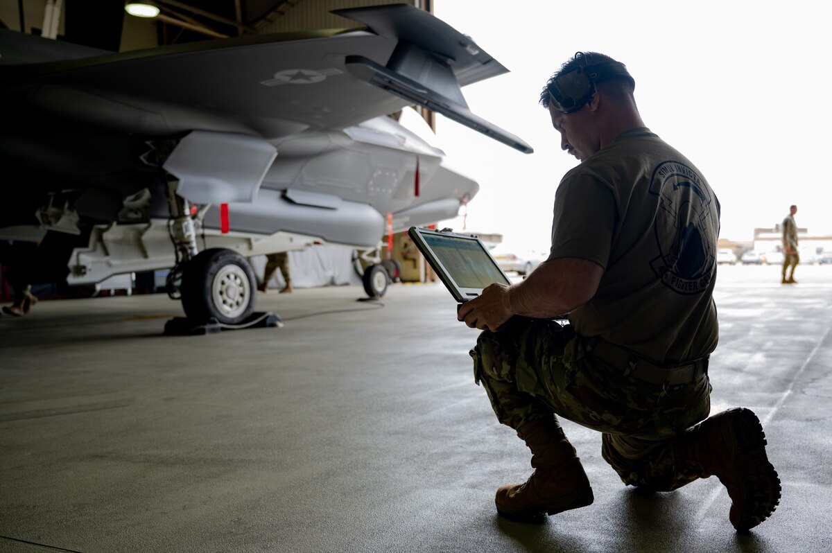 493rd FGS weapons load crew member reviews his technical order checklist during a load crew competition