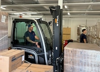 Jeremy Quick, a supply management specialist with Logistics Readiness Center Rheinland-Pfalz, moves food rations with a forklift at the Subsistence Supply Management Office warehouse in Baumholder, Germany. Quick will have seven years working for the Army in Baumholder as a German local national employee in November, but his mother has over 39. (U.S. Army courtesy photo)