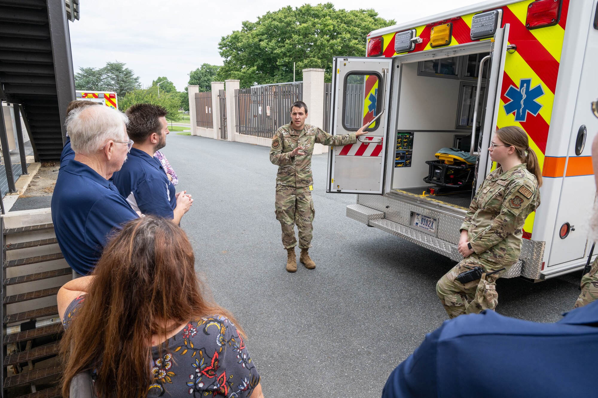 U.S. Air Force Senior Airman Hayden Burdge, 436th Health Care Operations Squadron ambulance services technician, shows a group of honorary commanders the inside of an ambulance during a tour of the medical clinic at Dover Air Force Base, Delaware, July 18, 2024. The HCCs toured various elements of the 436th MDG to familiarize them with the group's facilities, mission and capabilities. (U.S. Air Force photo by Mauricio Campino)