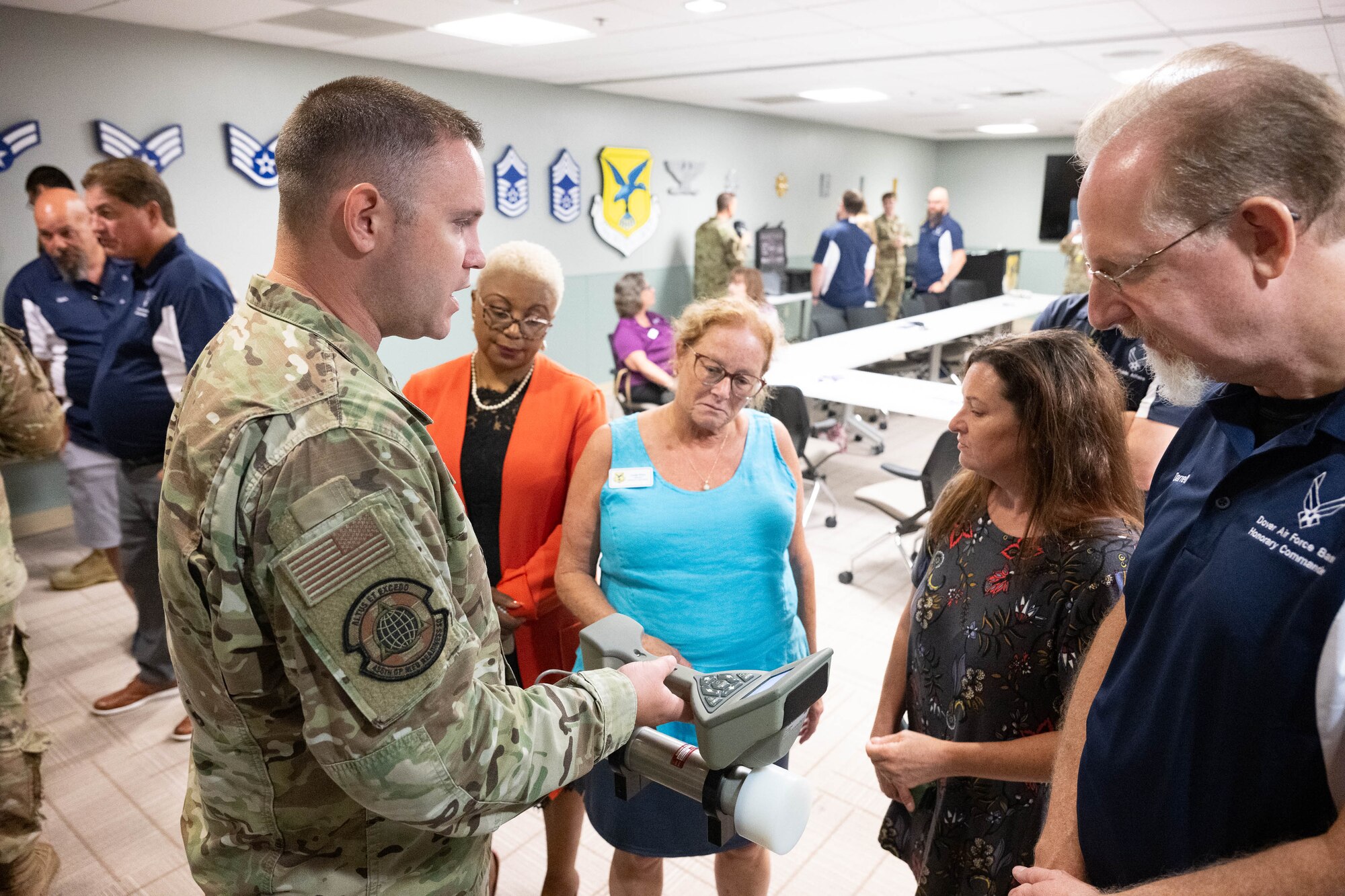 U.S. Air Force Tech Sgt. Justin Inman, 436th Operational Medical Readiness Squadron noncommissioned officer in charge of occupational health, shows a SAM 940
handheld radiation isotope identifier to a group of honorary commanders during a tour of the medical clinic at Dover Air Force Base, Delaware, July 18, 2024. The HCCs toured various elements of the 436th MDG to familiarize them with the group's facilities, mission and capabilities. (U.S. Air Force photo by Mauricio Campino)
