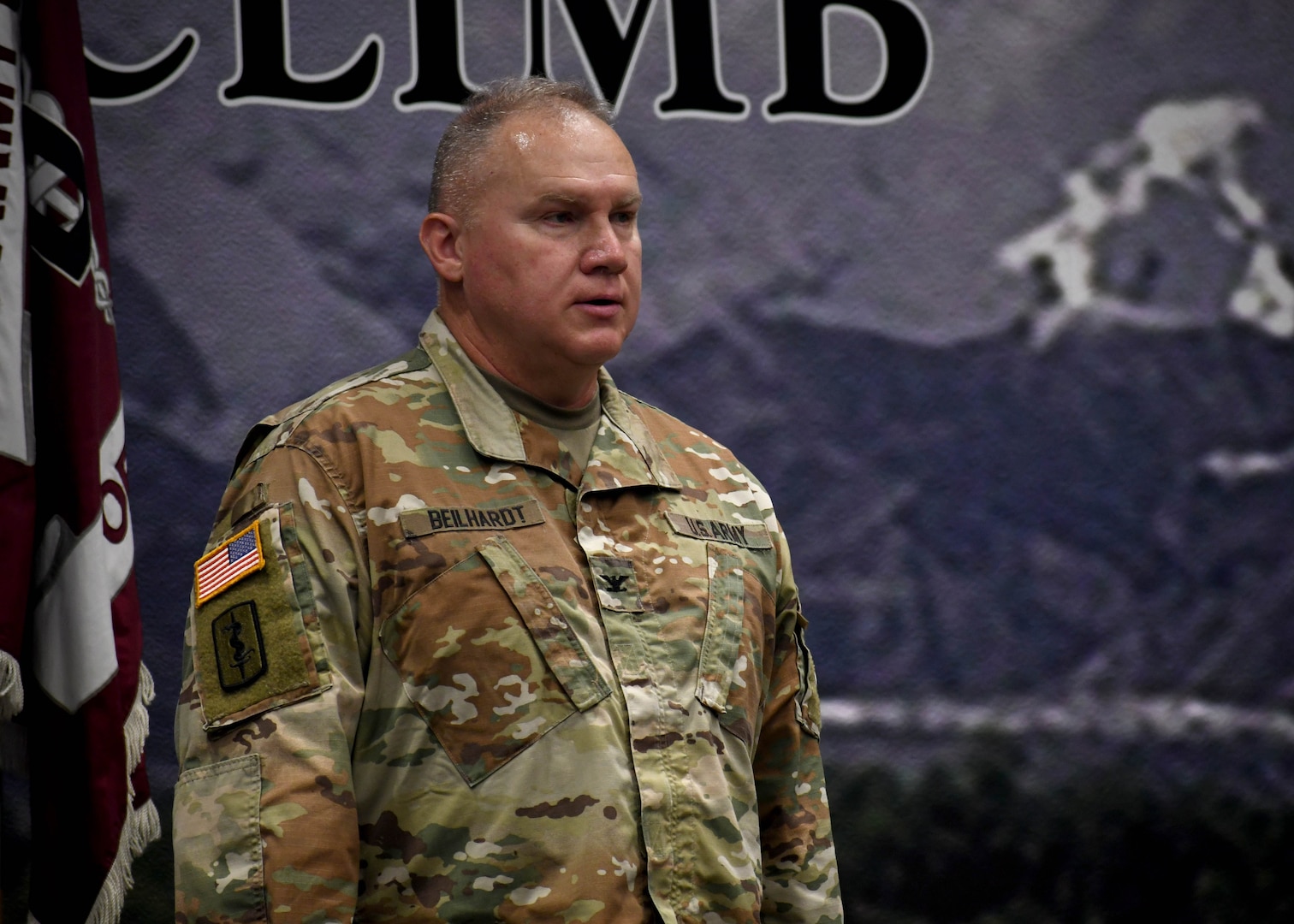 Photo of Col. Ralf C. Beilhardt, commander of Fort Drum’s Dental Health Activity, standing on stage following his change of command ceremony.