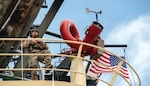 Technical Sergeant Justin Davis, tactical air control party specialist with 137th Special Operations Wing, Oklahoma National Guard, acts as intelligence, surveillance, and reconnaissance air asset for multinational military members participating in antipiracy exercise on vessel moored at shore base facility during Tradewinds 23 in Georgetown, Guyana, July 24, 2023 (U.S. Air National Guard/Brigette Waltermire)