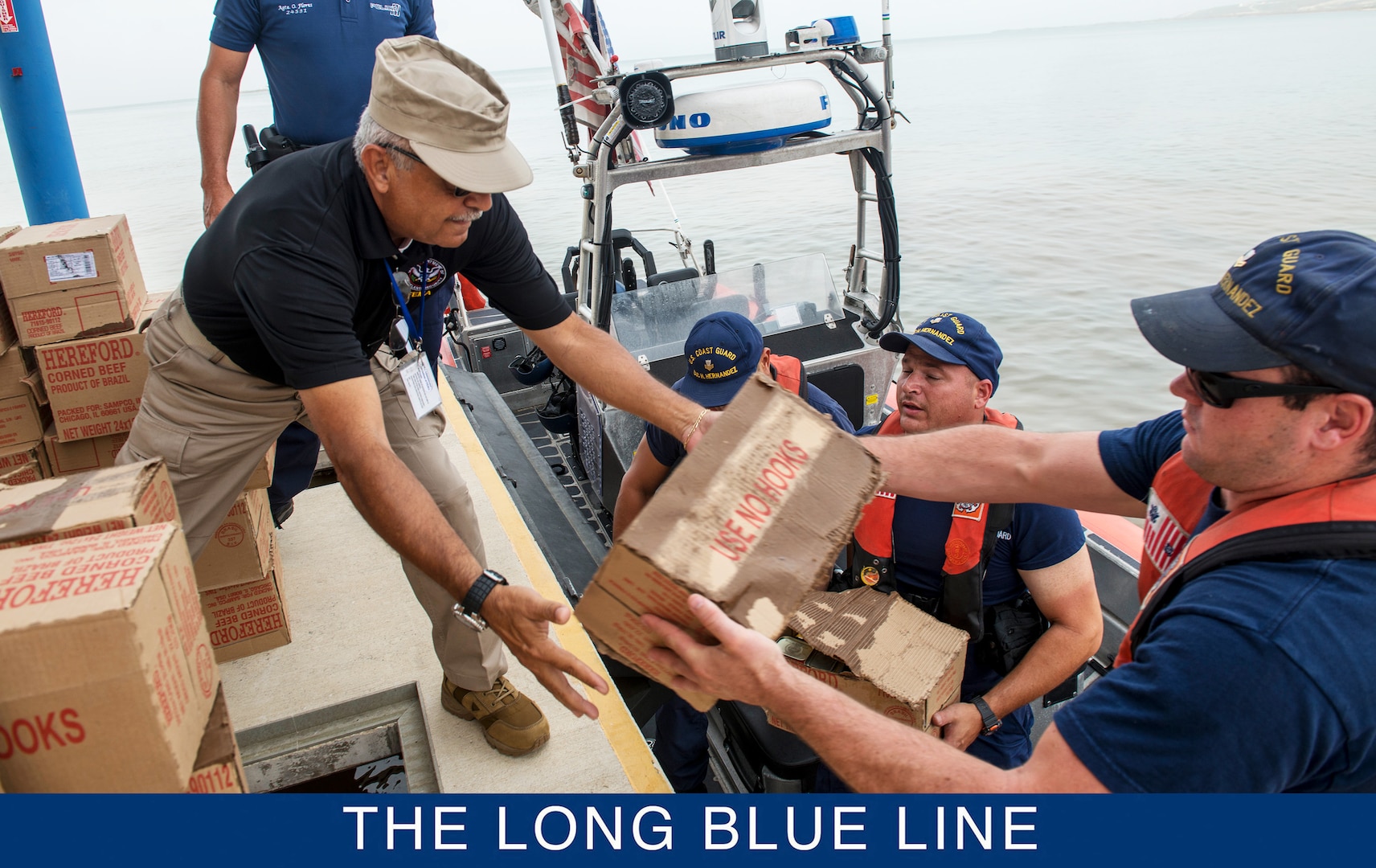 U.S. Coast Guardsmen assigned to the USCGC Heriberto Hernandez (WPC 1114), a Fast Response Cutter homeported in San Juan, Puerto Rico, delivers food near the port of Ponce, Puerto Rico, Sept. 27, 2017. (U.S. Coast Guard photo by Petty Officer 1st Class Michael De Nyse)