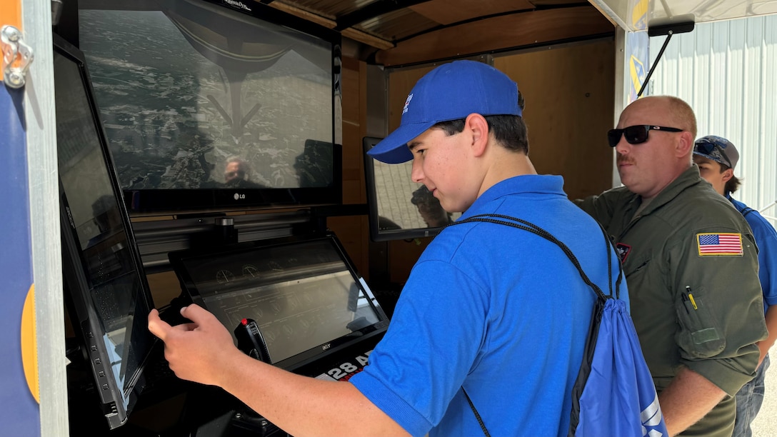 Youth from the EAA Air Camp learn how to use the mobile boom simulator at the Wisconsin Air National Guard’s 128th Air Refueling Wing in Milwaukee June 25. These future aviators toured the wing’s KC-135 Stratotankers, saw jet engines up close and tried their hand on the boom simulator. 128th Air Refueling Wing photo by Master Sgt. Kellen Kroening