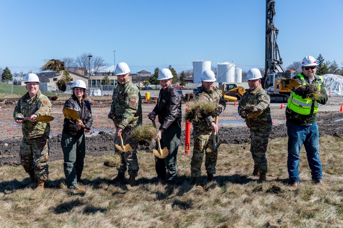 Current commander of the Air National Guard’s 128th Air Refueling Wing (ARW), Col. Charles Merkel (middle), is joined by previous 128th ARW commanders — Col. Adria Zucarro, Col. Michael Guch, and Col. Ted Metzger; Brig. Gen. David May, Assistant Adjutant General - Air, Wisconsin National Guard, Command Sgt. Maj. Chad Workman, Sean Giese, resident engineer, U.S. Army Corp of Engineers, Omaha District Fort McCoy Office to break ground during a ceremony at General Mitchell Air National Guard Base, Milwaukee, Wisconsin. This ceremony celebrates the construction commencement of a state-of-the-art Type III Petroleum, Oils and Lubricants facility.