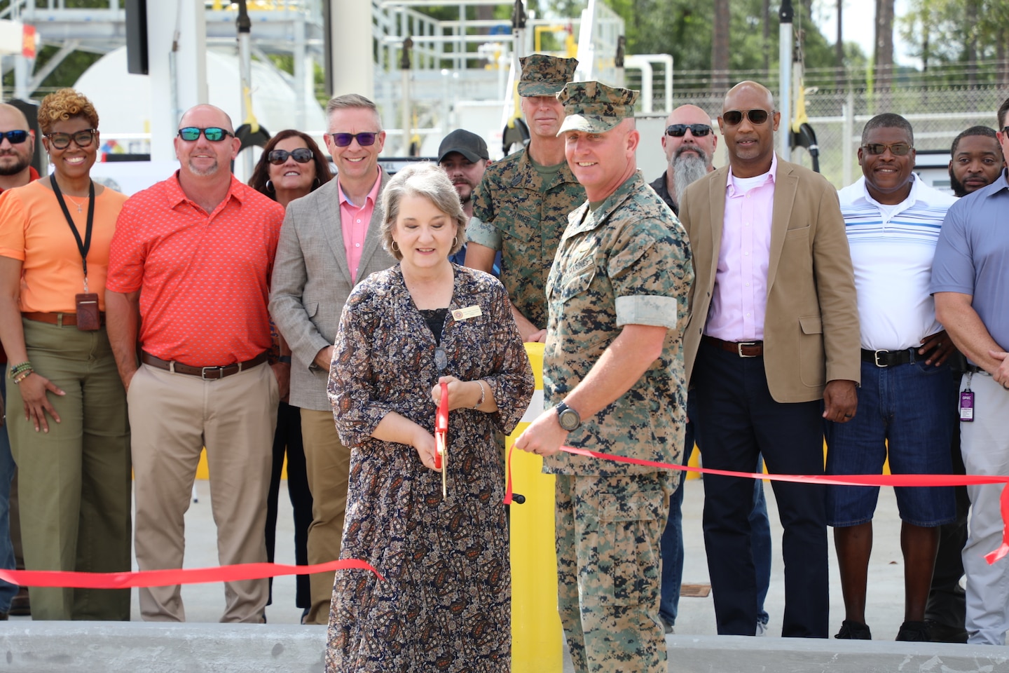 Members from the Marine Corps Logistic Base team in Albany, Georgia cut the ribbon on a new ground fuels station. Ms. Kelly Eadie-Leverette, director, logistics support division (center) and Col. Matthew McKinney, base commander, July 10.  (U.S. Army Corps of Engineers photo)