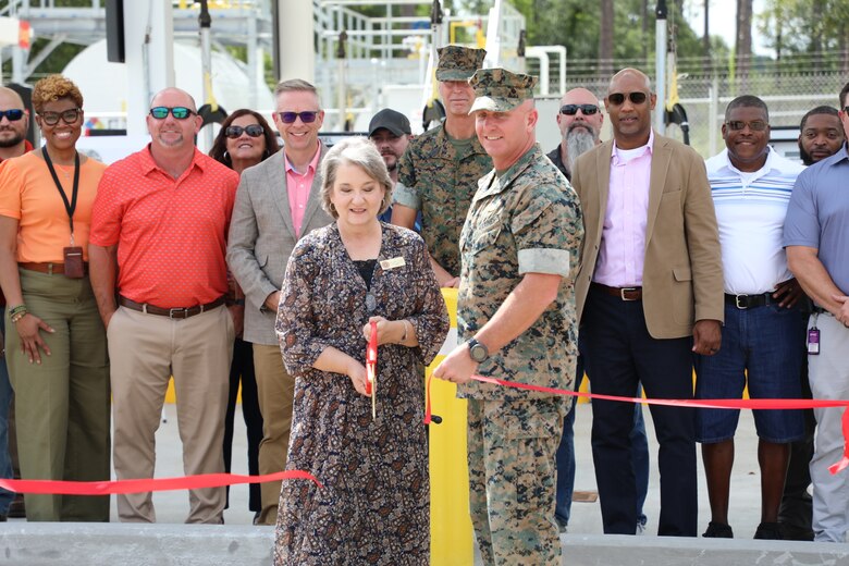 Members from the Marine Corps Logistic Base team in Albany, Georgia cut the ribbon on a new ground fuels station. Ms. Kelly Eadie-Leverette, director, logistics support division (center) and Col. Matthew McKinney, base commander, July 10.  (U.S. Army Corps of Engineers photo)