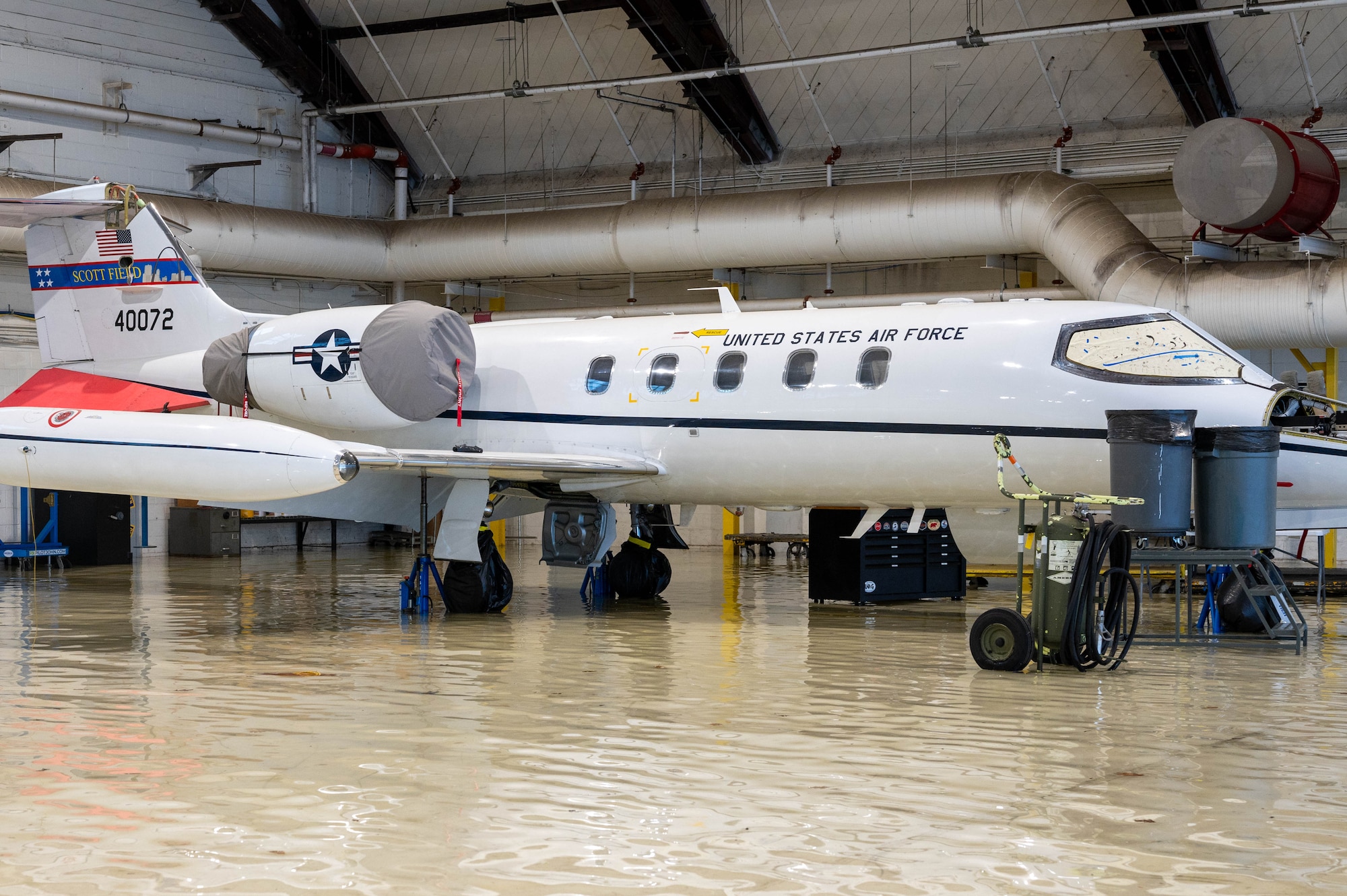 plane sits in flooding water