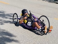 Spc. (R) Corine Hamilton competes in hand cycling at the 2024 Department of Defense Warrior Games