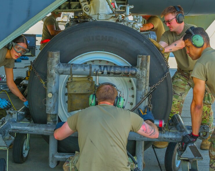 Airmen assigned to the 5th Aircraft Maintenance Squadron compete in the 5th Maintenance Group’s inaugural Mission Generation Competition at Minot Air Force, North Dakota, July 17, 2024. The competition consisted of changing a jet tire, assembling guided munitions, and attaching munitions to a B-52H Stratofortress.