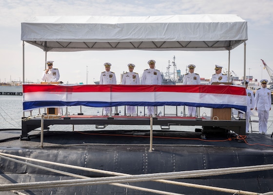 Submarine Force leadership stand at attention as the Virginia-class fast-attack submarine USS Washington (SSN 787) receives a Meritorious Service Medal during the boat’s change of command ceremony onboard Naval Station Norfolk, July 19, 2024.