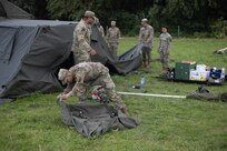 Sgt. Michael Martin, Echo Company, 91t Brigade Engineer Battalion, packs equipment at the rest stop area at the Nijmegen march on July 16, 2024, in Nijmegen, Netherlands. Martin assisted U.S. participants as they arrived at the rest stops along the route.

(U.S. Army photo by Capt. Michael Mastrangelo)