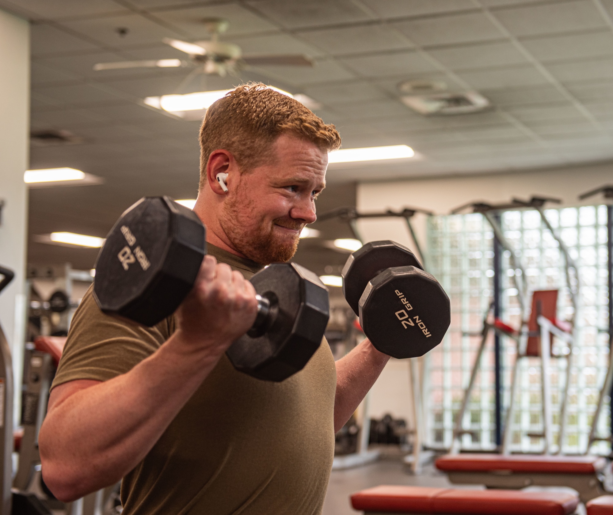 U.S. Air Force Airman does bicep curls at Moody Air Force Base, Georgia, July 02, 2024. Physical fitness is important in upkeep a service member's operational readiness. (U.S. Air Force photo by Airman 1st Class Sir Wyrick)