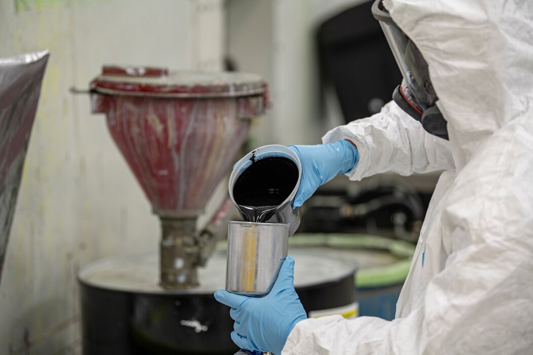 An U.S. Air Force Airman assigned to the 23rd Maintenance Squadron pours paint into a paint gun in preparation for the repainting of an A-10C Thunderbolt II at Moody Air Force Base, Georgia, July 17, 2024. During the repainting process of the A-10C Thunderbolt II protective gear is worn during the painting process to avoid fume inhalation or skin contact. (U.S. Air Force photo by Airman 1st Class Leonid Soubbotine)