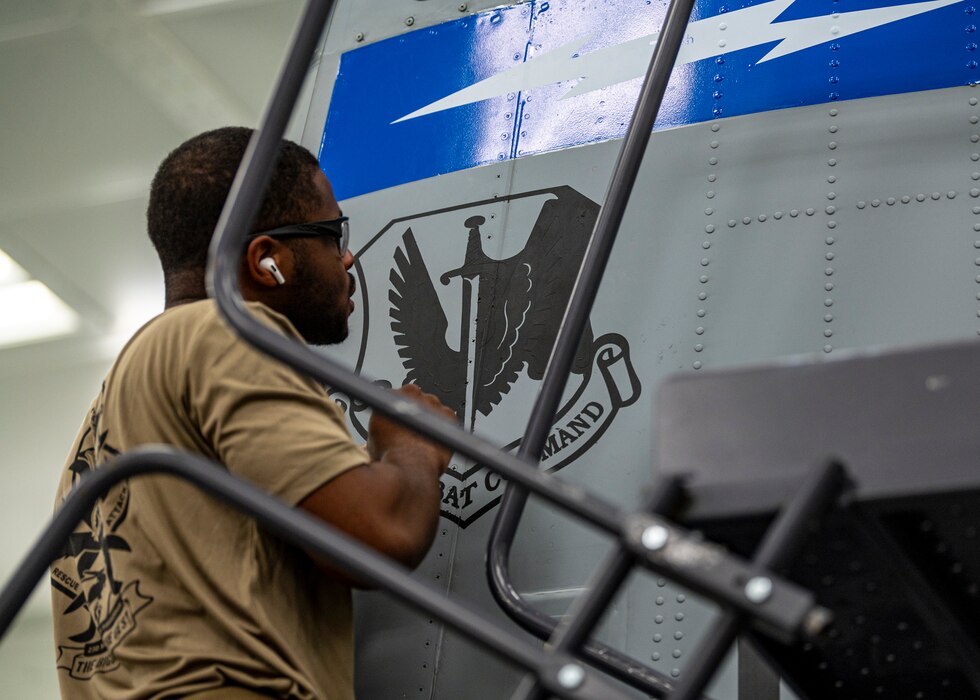 U.S. Staff Sgt. William Rogers, 23rd Maintenance Squadron aircraft structural maintenance craftsman, applies an Air Combat Command decal to an A-10C Thunderbolt II during a re-paint at Moody Air Force Base, Georgia, July 19, 2024. Air Combat Command Moody Air Force Bases major command and is the primary force provider of combat airpower to U.S. warfighting commands. (U.S. Air Force photo by Airman 1st Class Leonid Soubbotine)