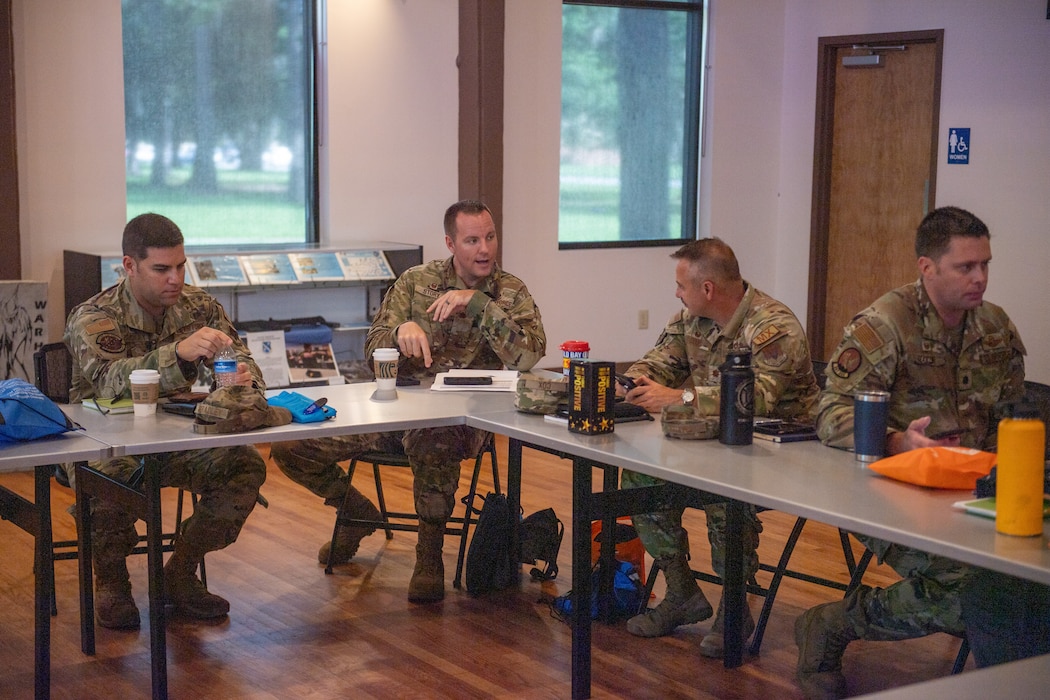 U.S. Air Force squadron commanders assigned to the 23rd Wing discuss topics from the class during an annual Squadron Commander’s Course at Moody Air Force Base, Georgia, July 18, 2024.This course is held annually to ensure squadron commanders are equipped with installation resource knowledge, while enhancing leadership skills and bonds with other commanders across the base. (U.S. Air Force photo by Airman 1st Class Cade Ellis)