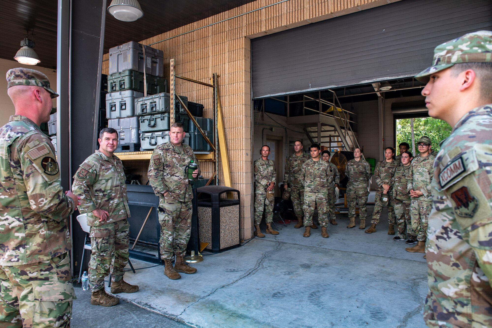 U.S. Air Force Col. Paul Sheets, 23d Wing commander (2nd from left) listens to a brief during Rehearsal of Concept (ROC) drill at Moody Air Force Base, Georgia, July 18, 2024.
