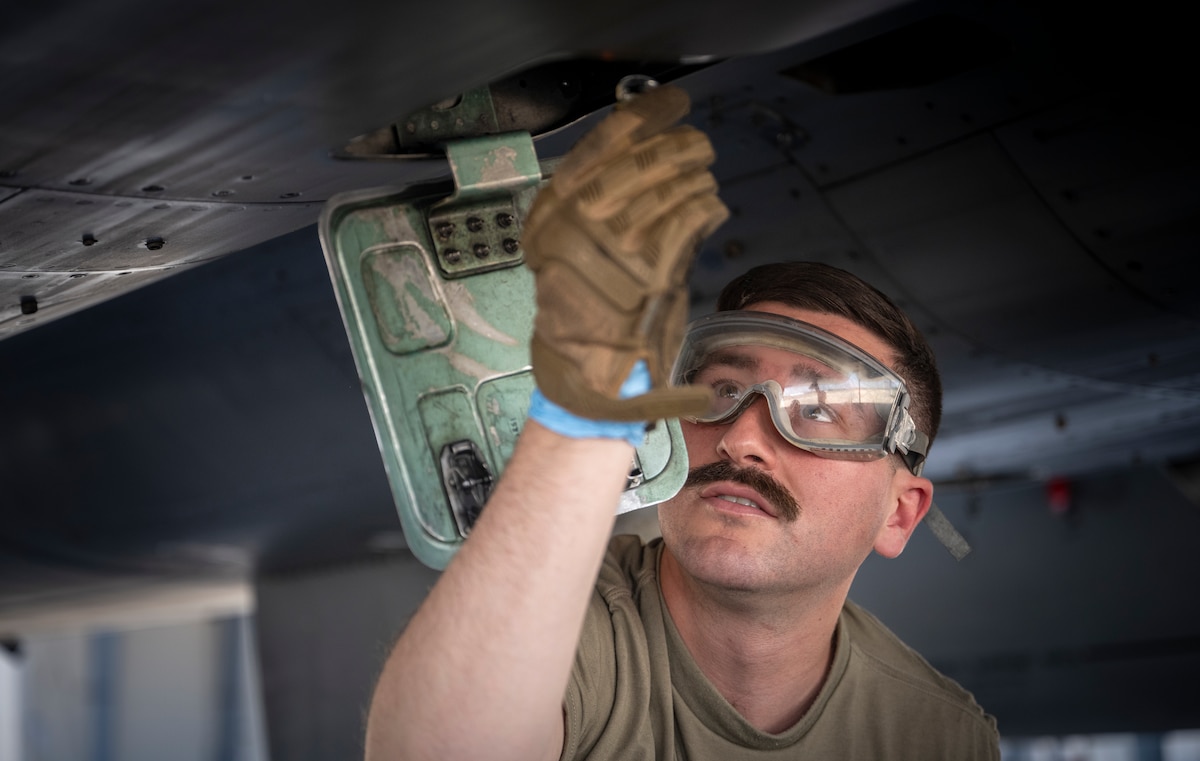 A 821st Contingency Response Squadron Airman performs F-15C Eagle maintenance at Fresno Air National Guard Base, California, May 22, 2024.