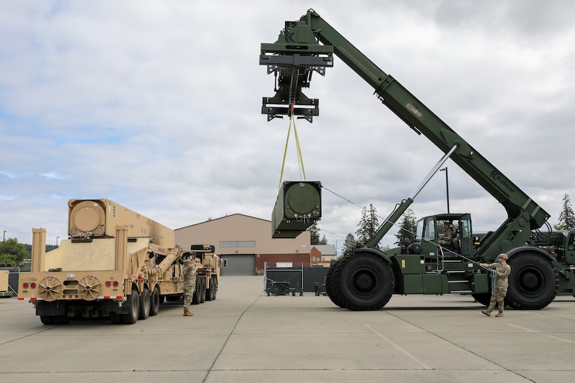 Soldiers assigned to Bravo Battery, 5th Battalion, 3rd Field Artillery (Long Range Fires Battalion), 1st Multi-Domain Task Force, swap a pod on one of the Long Range Hypersonic Weapon Transporter Erector Launchers in preparation for exercise Resolute Hunter 24-2 on Joint Base Lewis-McChord, Wash., June 24, 2024.