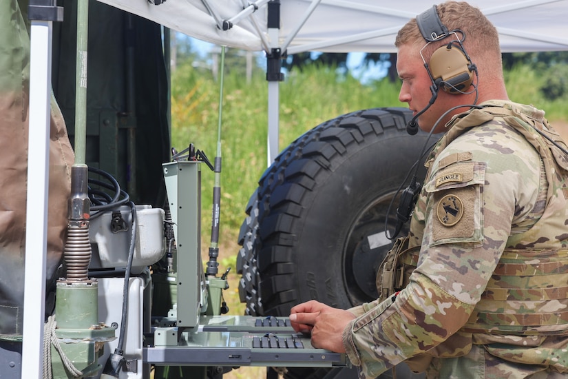 A platoon leader assigned to Bravo Battery, 5th Battalion, 3rd Field Artillery (Long Range Fires Battalion), 1st Multi-Domain Task Force, provides real-time situational awareness to the joint command post during exercise Resolute Hunter 24-2 on Joint Base Lewis-McChord, Wash., June 25, 2024.