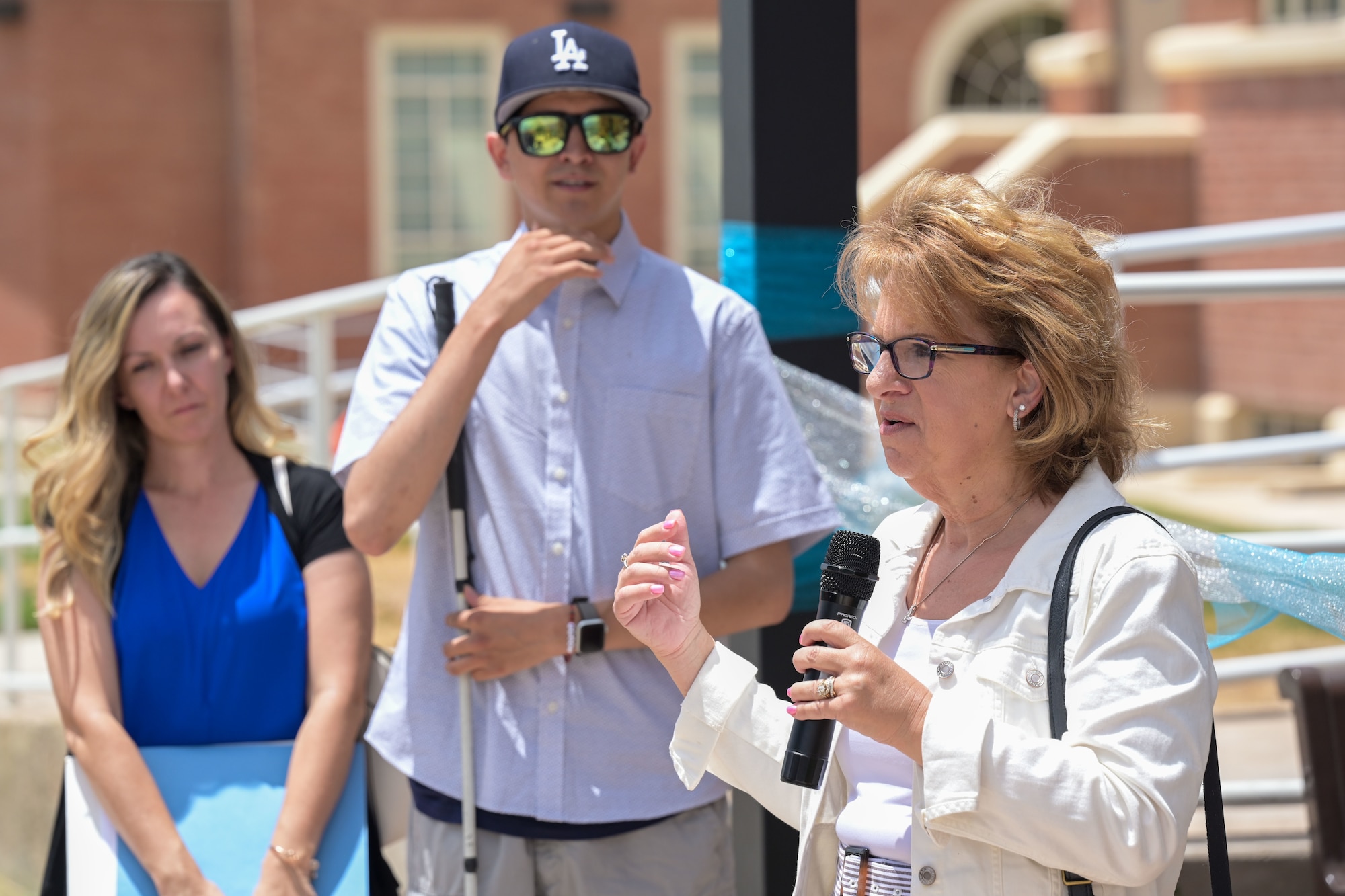 Alamogordo Mayor Susan Payne, right, speaks at the opening of a multi-sensory garden at the New Mexico School for the Blind and Visually Impaired in Alamogordo, New Mexico, July 18, 2024.
