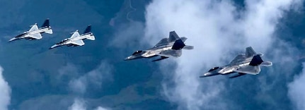 Philippine Air Force FA-50’s fly alongside U.S. Air Force F-22 Raptor’s form the 199th Expeditionary Fighter Squadron during low-level training at Basa Air Base, Philippines, June 14, 2024.