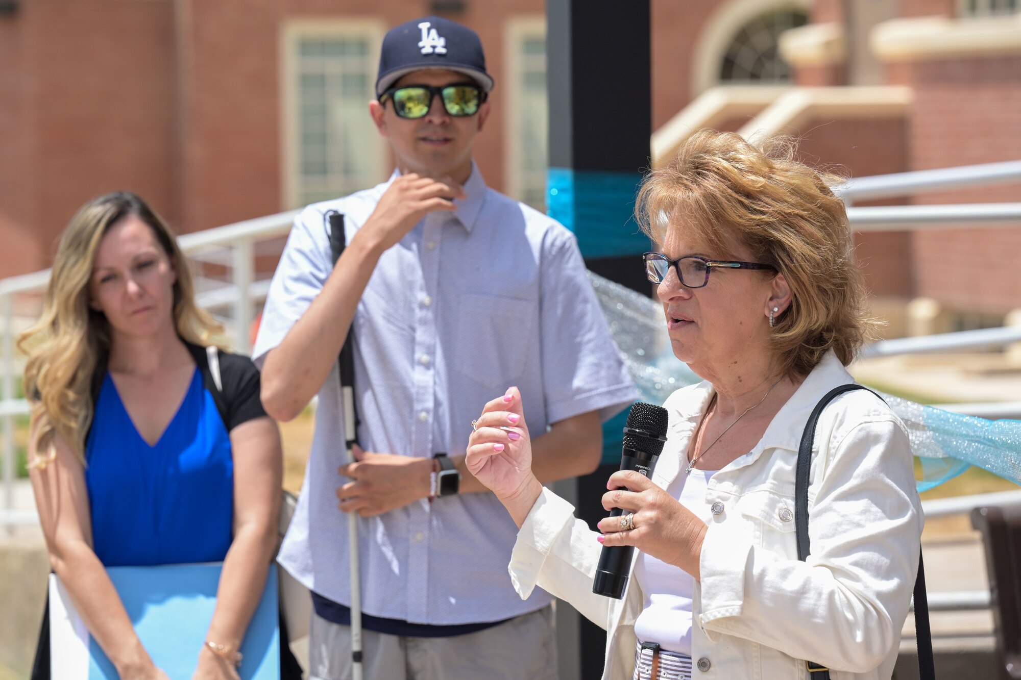 Alamogordo Mayor Susan Payne, right, speaks at the opening of a multi-sensory garden at the New Mexico School for the Blind and Visually Impaired in Alamogordo, New Mexico, July 18, 2024.
