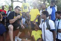 PORT VILA, Vanuatu (July 18, 2024) – U.S. Army Spc. Joshua Barney, of Salt Lake City, Utah interacts with students of Kawenu Primary School, during a community outreach event as part of Pacific Partnership 24-2 in Port Vila, Vanuatu, July 18, 2024. Pacific Partnership the U. S. Navy's largest humanitarian and civic assistance mission with partner-nations, non-governmental organizations and other government agencies to execute a variety of humanitarian civic action missions across the Indo-Pacific. The annual mission is designed to strengthen relationships and improve U.S. and partner-capacity to deliver humanitarian assistance and disaster-relief preparedness. (U.S. Navy photo by Mass Communication Specialist 1st Class Ryan D. McLearnon/Released)