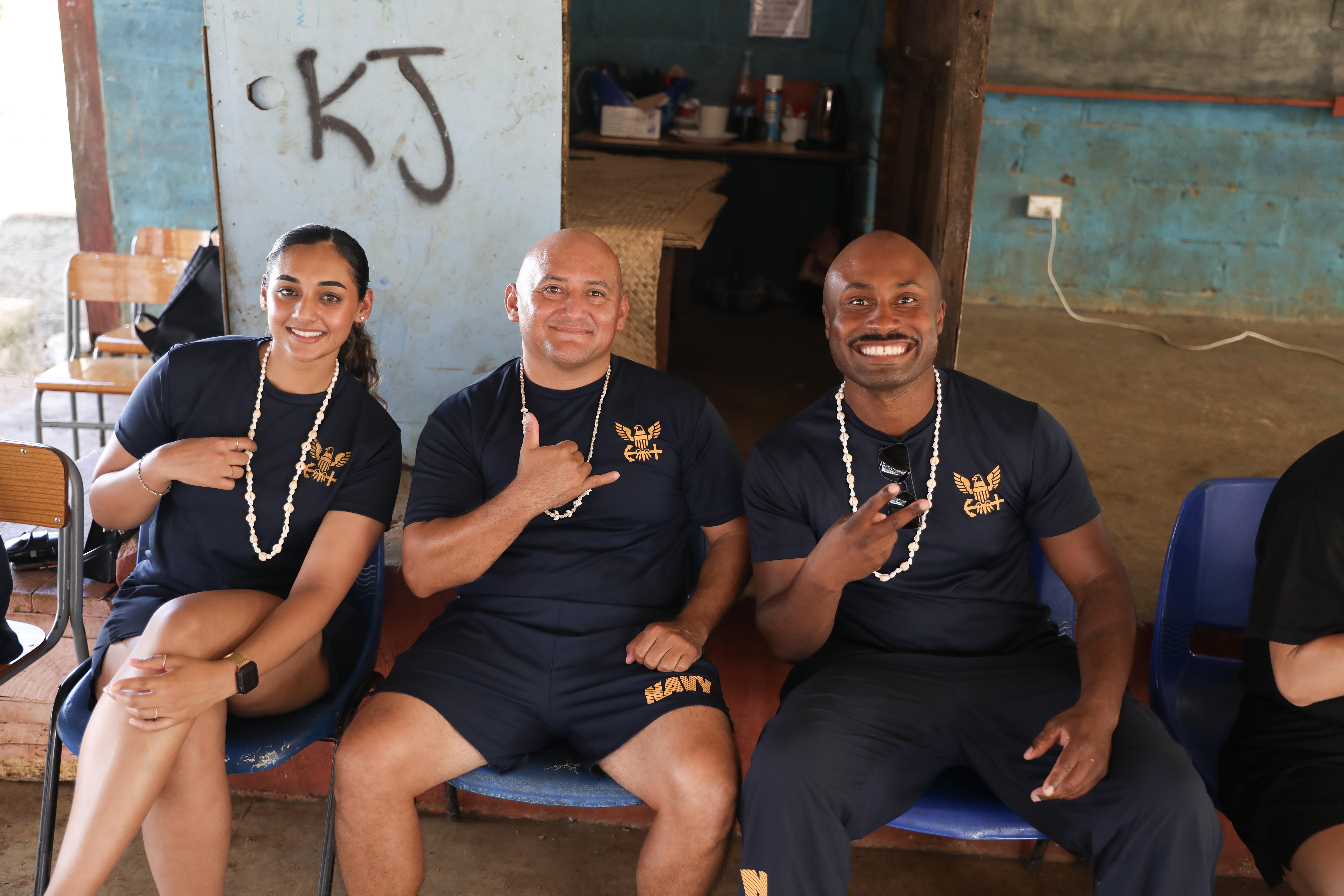 PORT VILA, Vanuatu (July 18, 2024) – U.S. Navy Sailors pose for a photo at the Kawenu Primary School, during a community outreach event as part of Pacific Partnership 24-2 in Port Vila, Vanuatu, July 18, 2024. Pacific Partnership the U. S. Navy's largest humanitarian and civic assistance mission with partner-nations, non-governmental organizations and other government agencies to execute a variety of humanitarian civic action missions across the Indo-Pacific. The annual mission is designed to strengthen relationships and improve U.S. and partner-capacity to deliver humanitarian assistance and disaster-relief preparedness. (U.S. Navy photo by Mass Communication Specialist 1st Class Ryan D. McLearnon/Released)