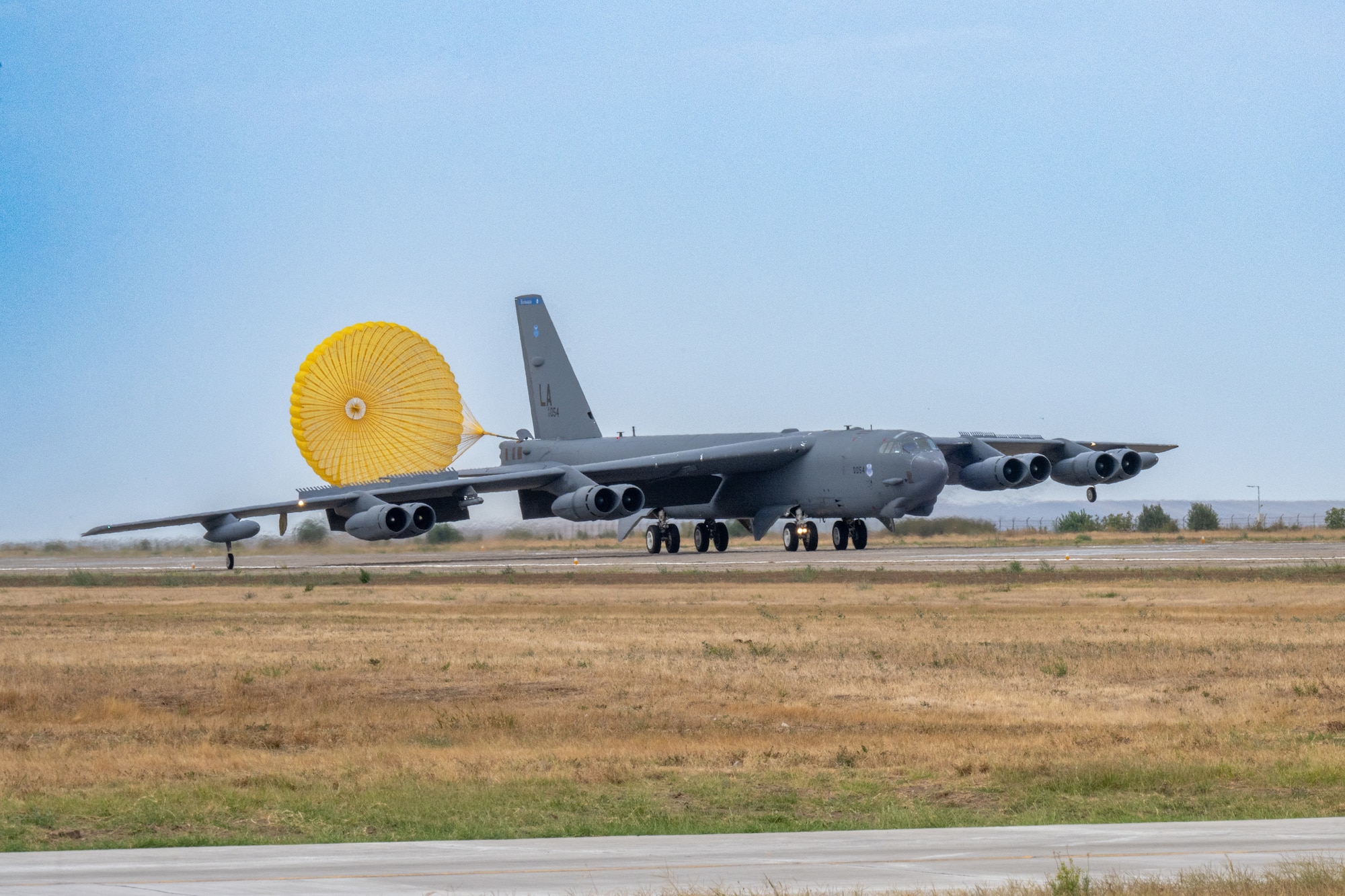 A B-52H Stratofortress from the 20th Bomb Squadron, Barksdale Air Force Base, La., makes its initial landing at Mihail Kogălniceanu Air Base, Romania, in support of Bomber Task Force Deployment 24-4, July 21, 2024. The lethal, long-range strike capabilities provided by strategic bombers influence the decision making of our nation’s competitors and adversaries by ensuring they know that the cost of military aggression would be outweighed by any potential gain. (U.S. Air Force Photo by Senior Airman Seth Watson)