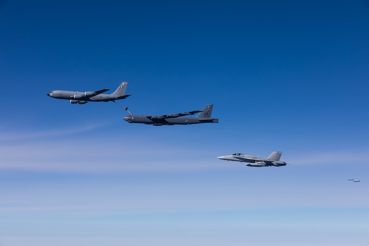 A KC-135 Stratotanker from the 100th Air Refueling Wing, Royal Air Force Mildenhall, England, refuels a B-52H Stratofortress from the 2nd Bomb Wing, Barksdale Air Force Base, La., while escorted by a Finnish F/A-18C Hornet during Bomber Task Force deployment 24-4, July 21, 2024. The U.S. Military works alongside NATO allies and partners to ensure a safe, stable, and secure Euro-Atlantic region by increasing military capabilities, readiness, and interoperability. (Courtesy Photo)
