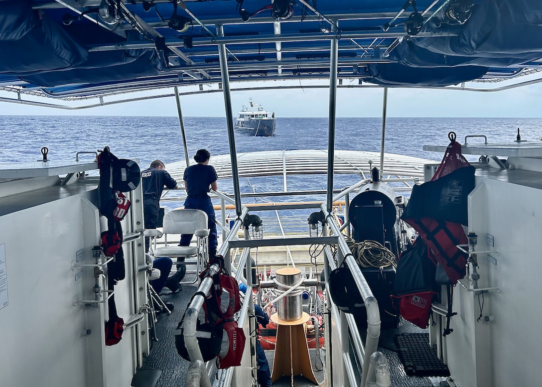 The USCGC Oliver Henry (WPC 1140) crew tow the 150-foot 497-ton motor yacht Black Pearl 1, located approximately 200 nautical miles west of the Republic of Palau, on July 21, 2024, after responding to a distress call. The 11-person yacht crew, who reported a locked rudder and flooding in the bilge, was assisted by Oliver Henry's crew with dewatering and damage control as they headed toward Palau in 25 mph winds and 4 to 6-foot seas. (U.S. Coast Guard photo by Petty Officer 3rd Class Ryder Nolan)