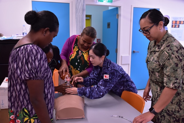 PORT VILA, Vanuatu (July 16, 2024) U.S. Navy Lt. Maribel Tatunay right, of Moreno Valley, Calif., and Lt. j.g. Chisato Ishikawa, of the Japanese Maritime Self-Defense Force, give a basic lifesaving class to Port Vila Central Hospital staff in support of Pacific Partnerships 24-2. Pacific Partnership the U. S. Navy's largest humanitarian and civic assistance mission with partner-nations, non-governmental organizations and other government agencies to execute a variety of humanitarian civic action missions across the Indo-Pacific. The annual mission is designed to strengthen relationships and improve U.S. and partner-capacity to deliver humanitarian assistance and disaster-relief preparedness. (U. S. Army photo by Civil Affairs Specialist Sgt. Jaron Nigoza)