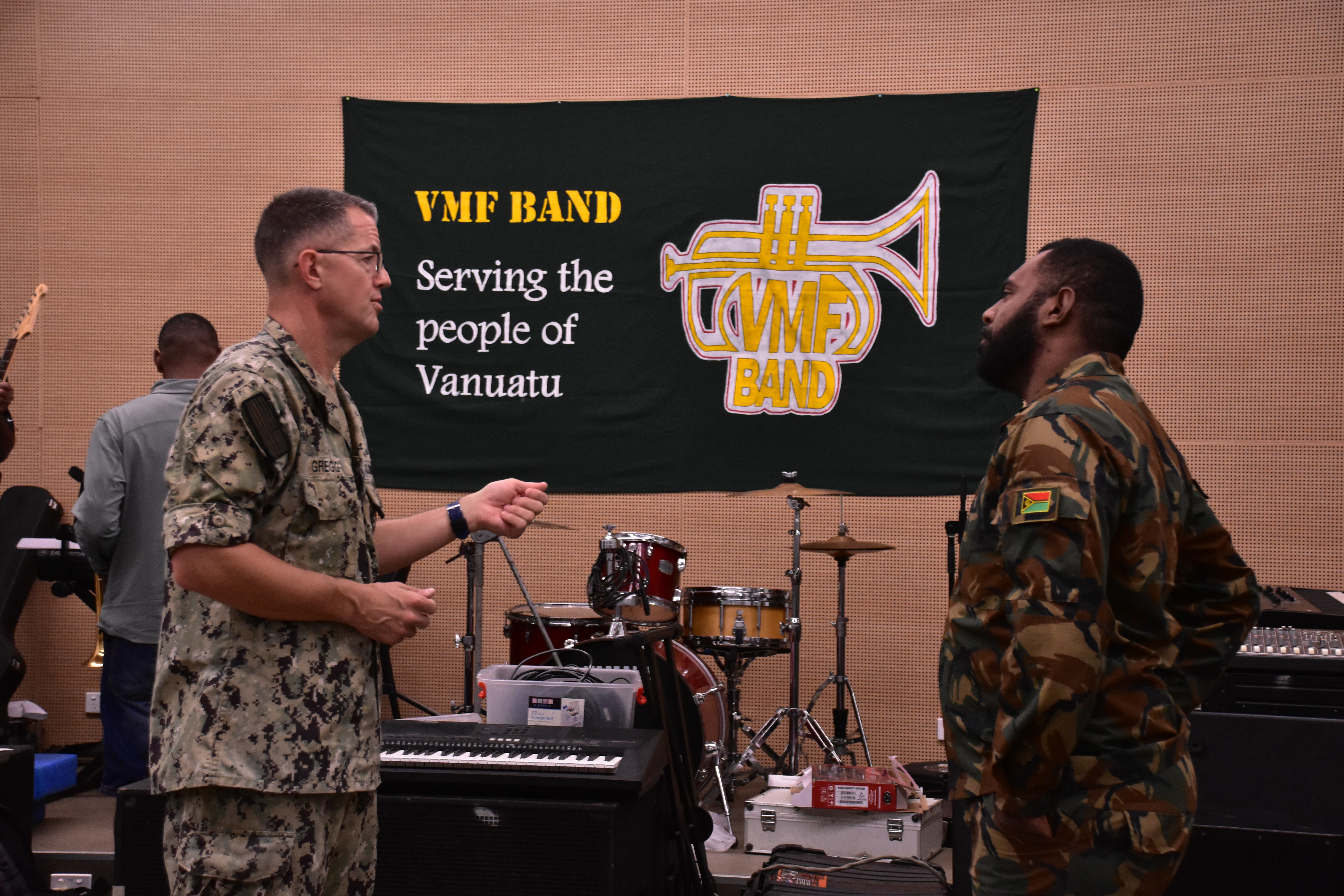 PORT VILA, Vanuatu (July 17, 2024) Master Chief Musician Guy Gregg (left), of Queen Creek, Ariz., with Bandmaster Sergeant William Roy Tom (right) of the Vanuatu Mobile forces band, discussing the specifics of the musical accompaniment for a ceremony during Pacific Partnership 24-2. Pacific Partnership is the U. S. Navy's largest humanitarian and civic assistance mission with partner-nations, non-governmental organizations and other government agencies to execute a variety of humanitarian civic action missions across the Indo-Pacific. The annual mission is designed to strengthen relationships and improve U.S. and partner-capacity to deliver humanitarian assistance and disaster-relief preparedness. (U. S. Army photo by Civil Affairs Specialist Sgt. Jaron Nigoza)