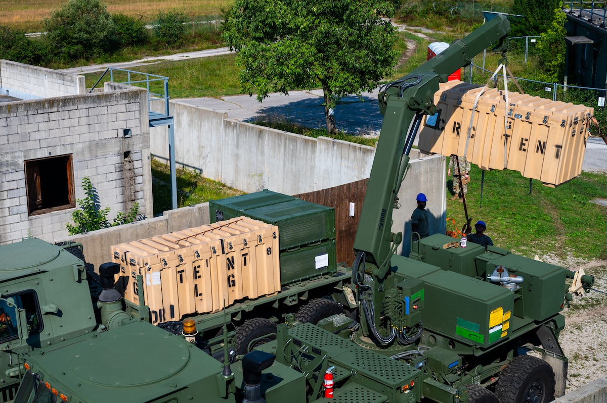 A crate is hoisted.