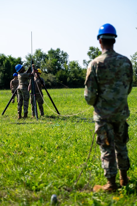 Airman set up an antenna.