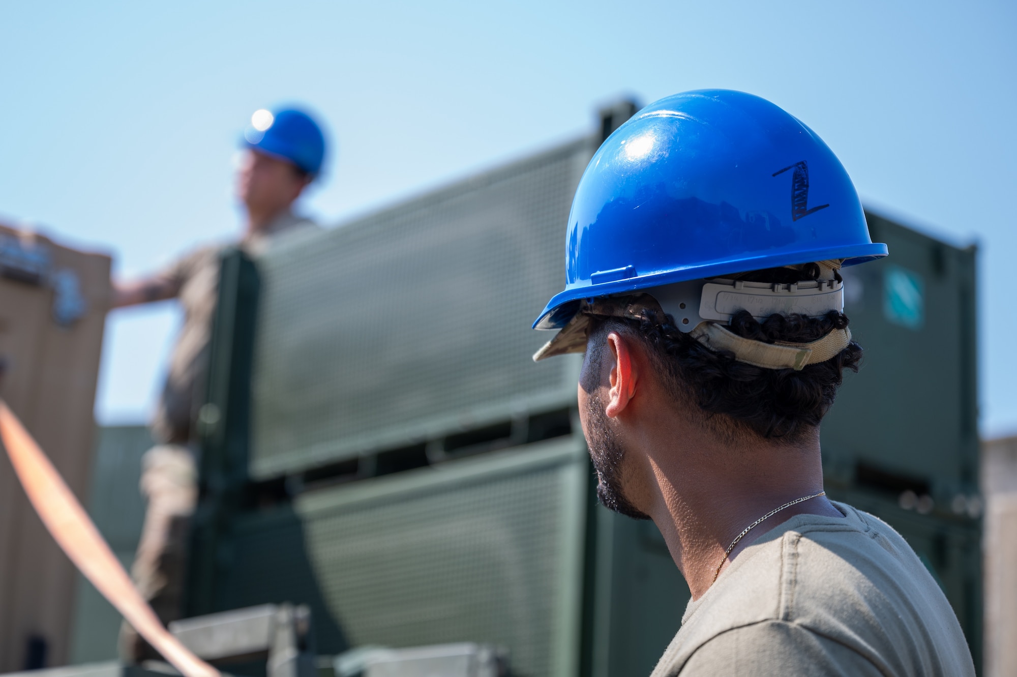 Airmen prepare to transport a crate.