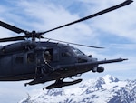 A 210th Rescue Squadron HH-60G Pave Hawk conducts hoist training June 5, 2018, at Eklutna Glacier during a fini flight for Chief Master Sgt. Lance Jordan, command chief master sergeant for the Alaska Air National Guard.