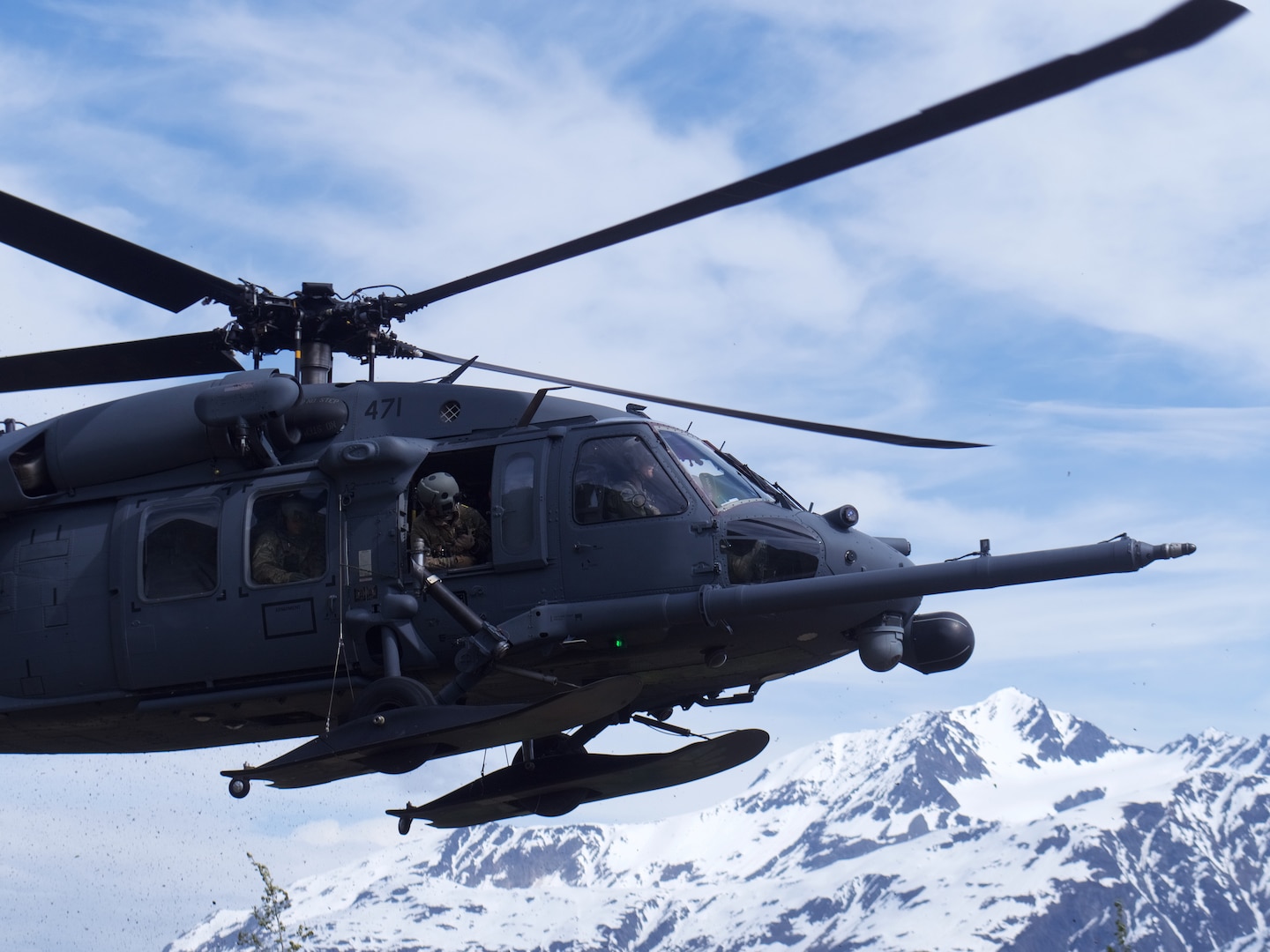 A 210th Rescue Squadron HH-60G Pave Hawk conducts hoist training June 5, 2018, at Eklutna Glacier during a fini flight for Chief Master Sgt. Lance Jordan, command chief master sergeant for the Alaska Air National Guard.