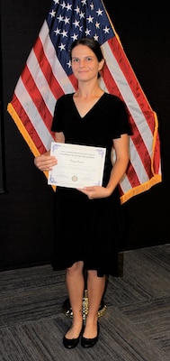 Devon Vance, an Information Technology (IT) Specialist for Naval Information Warfare Center Atlantic (NIWC), poses with her Excellence in Service Award from the New Orleans Federal Executive Board (FEB) following an award ceremony June 13 at the U.S. Department of the Interior Bureau of Safety and Environmental Enforcement New Orleans Office. Vance received an Honorable Mention for Leadership Excellence – Team Lead.