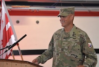 Col. Deon Maxwell approaches the podium after passing command of the U.S. Army Medical Materiel Center-Europe to Col. Chad Vermillion during a change of command ceremony July 10 at Kleber Kaserne in Kaiserslautern, Germany. (Holger Koelsch)