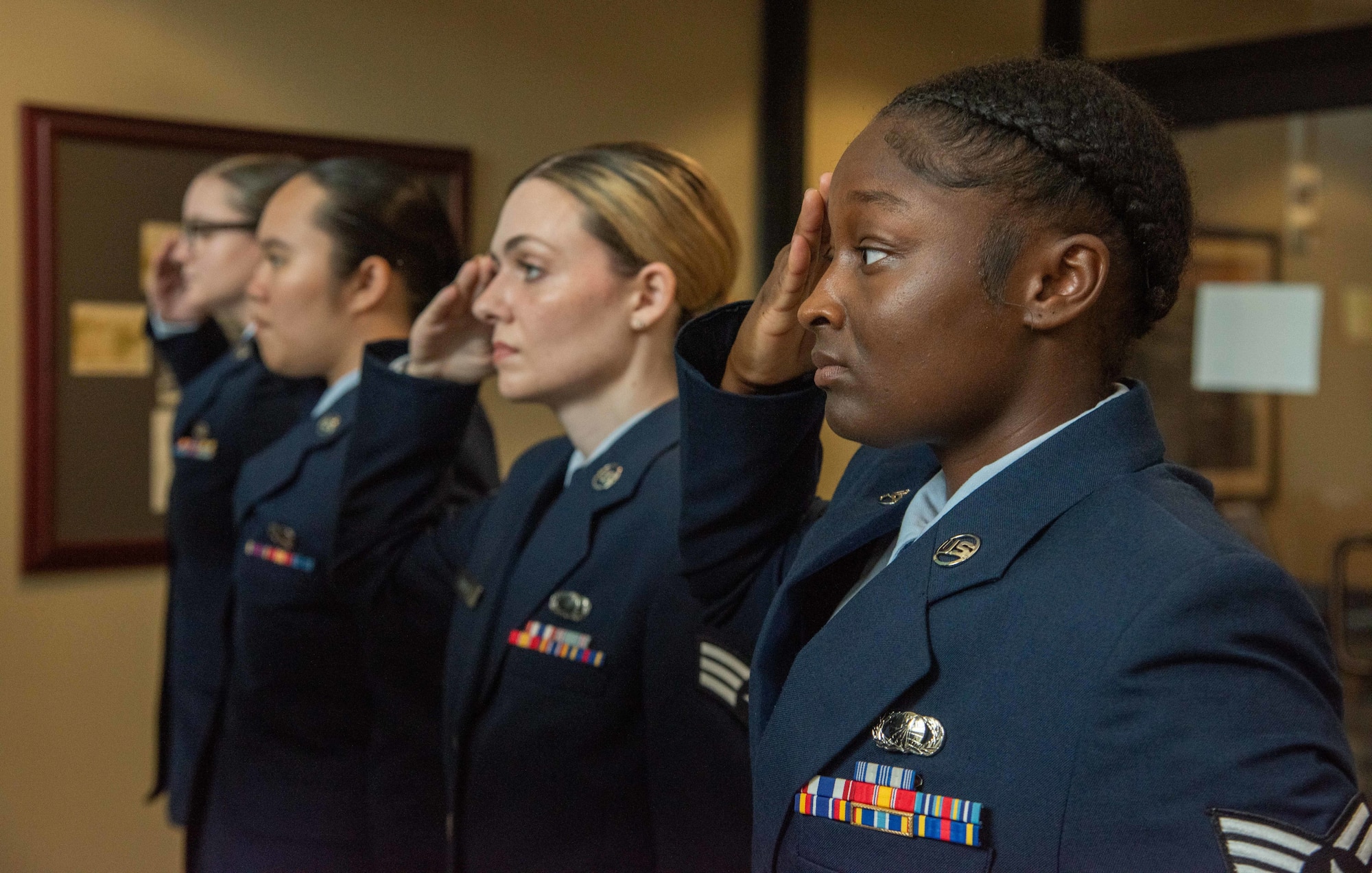 U.S. Air Force Airmen assigned to the 4th Comptroller Squadron render a first salute to U.S. Air Force Maj. Amy Bragg, 4th CPTS incoming commander, during a change of command ceremony at Seymour Johnson Air Force Base, North Carolina, June 28, 2024. During the ceremony, U.S. Air Force Maj. Aleksi Vega relinquished command of the 4th CPTS to Bragg. Change of command ceremonies are rooted in military history dated back to the 18th century and serves as an opportunity for members of the unit to witness their new leader assume the responsibility and trust associated with the position of commander.  (U.S. Air Force photo by Tech. Sgt. Christopher Hubenthal)