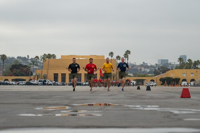 U.S. Marine Corps drill masters with Recruit Training Regiment lead the formation during a motivational run at Marine Corps Recruit Depot San Diego, California, July 18, 2024. The company motivational run is a three-mile cadence run conducted around the Depot and is the last physical training event the Marines will conduct before they graduate from MCRD San Diego. The event is also the first time friends and families will see their newly transformed Marines. (U.S. Marine Corps photo by Lance Cpl. Francisco Angel)