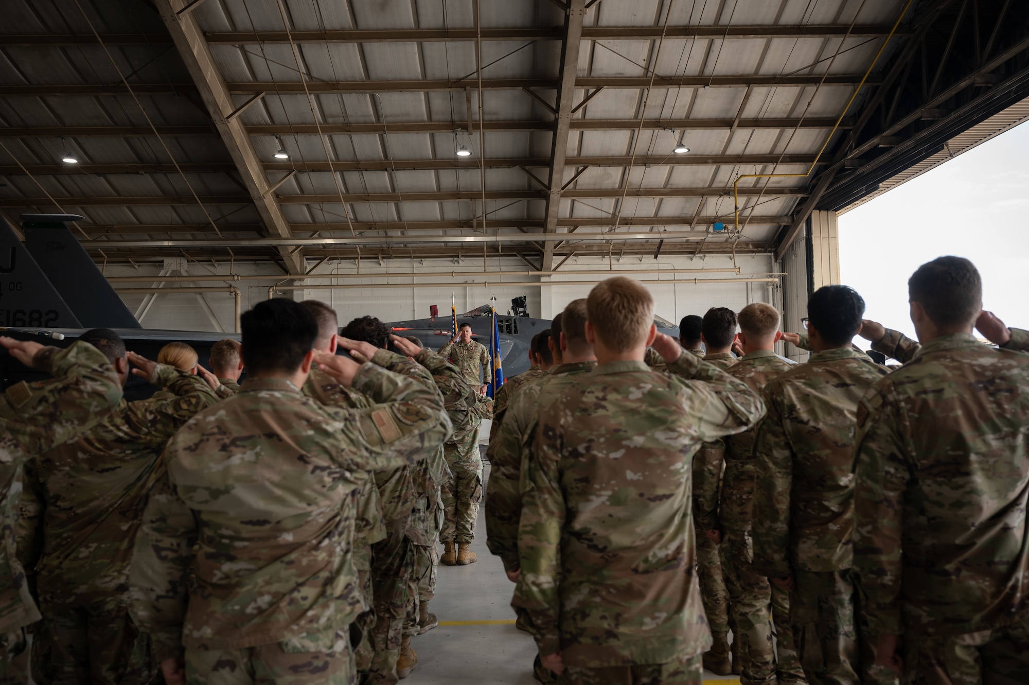 U.S. Air Force Maj. Mark Smith, 336th Fighter Generation Squadron outgoing commander, renders a final salute to the 336th FGS during a change of command ceremony at Seymour Johnson Air Force Base, North Carolina, June 28, 2024. Final salutes are a change of command ceremony tradition, rendered prior to the passing of the guidon. (U.S. Air Force photo by Senior Airman Rebecca Sirimarco-Lang)
