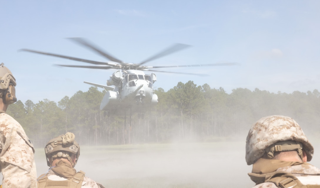 U.S. Marines with 2nd Distribution Support Battalion, Combat Logistics Regiment 2, 2nd Marine Logistics Group, conduct helicopter support team operations at Tactical Landing Zone Condor on Camp Lejeune, North Carolina, July 18, 2024. 2nd DSB conducted the training to prepare Marines to manage activities at landing zones; facilitate the pickup, movement, and landing of helicopter-borne troops, equipment, and supplies. (U.S. Marine Corps photo by Lance Cpl. Franco Lewis)