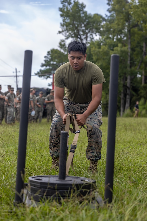 A U.S. Marine with 2nd Marine Logistics Group drags a weighted sled during the Fittest of the 2nd MLG event hosted by the 2nd MLG Human Performance Center on Camp Lejeune, North Carolina, July 19, 2024. Teams from across 2nd MLG regiments and battalions competed for the title of “Fittest of 2nd MLG” in order to promote physical fitness, camaraderie, and friendly competition. (U.S. Marine Corps photo by Lance Cpl. Christian Salazar)