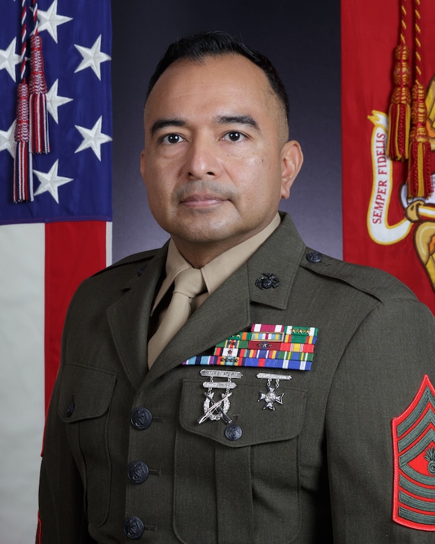 Bio picture with US and Marine Corps display flags